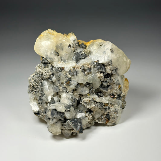 Calcite with arsenopyrite, chalcopyrite and quartz