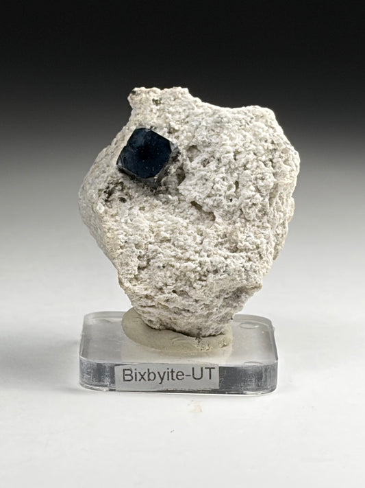 Bixbyite on Phyolite