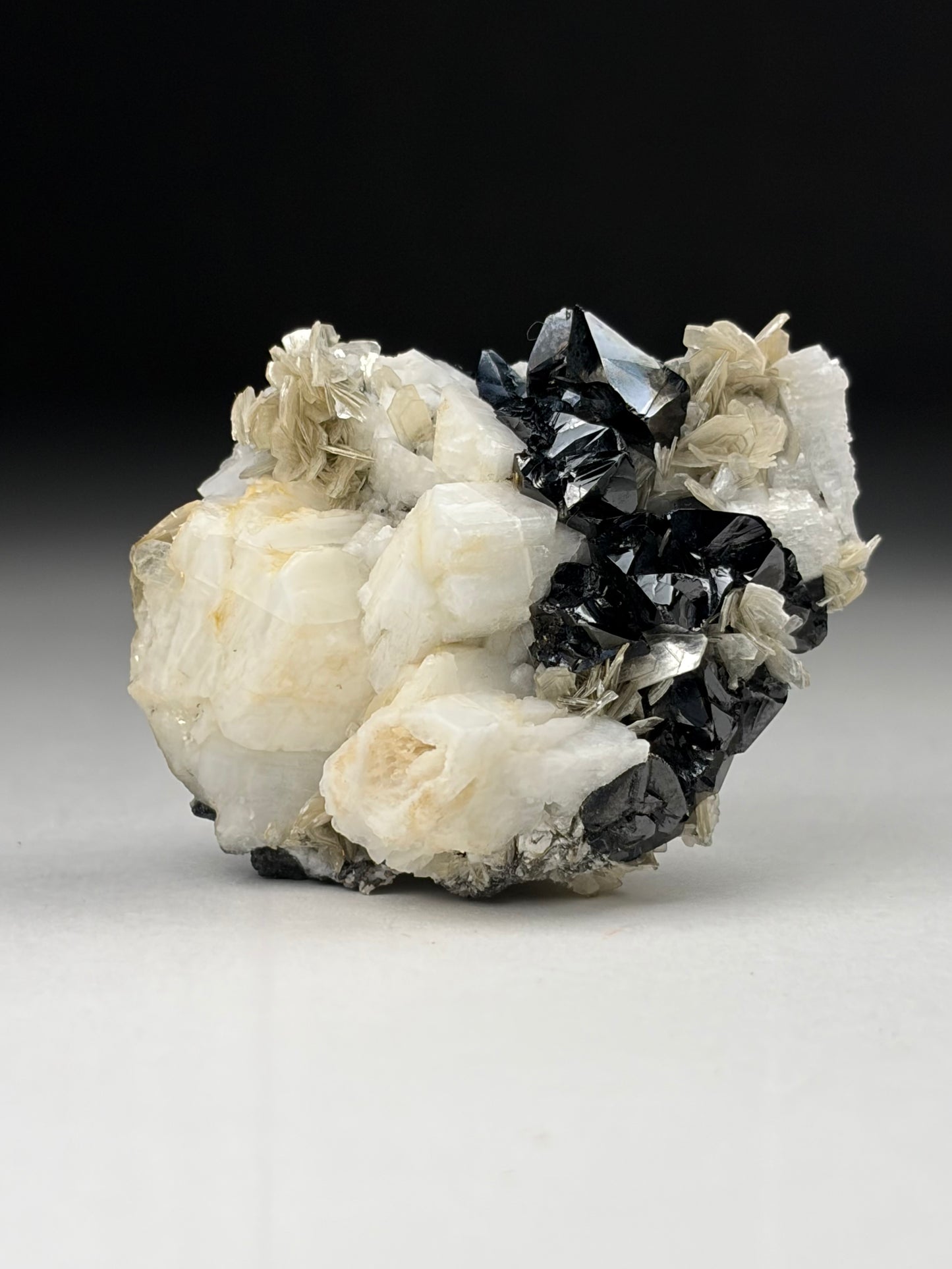 Cassiterite w/ Microcline on Muscovite